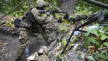 Ukrainian soldiers take part in tactical and medical training exercises in Kharkiv.
