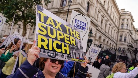 A pro-wealth tax protestor in the UK in 2022
