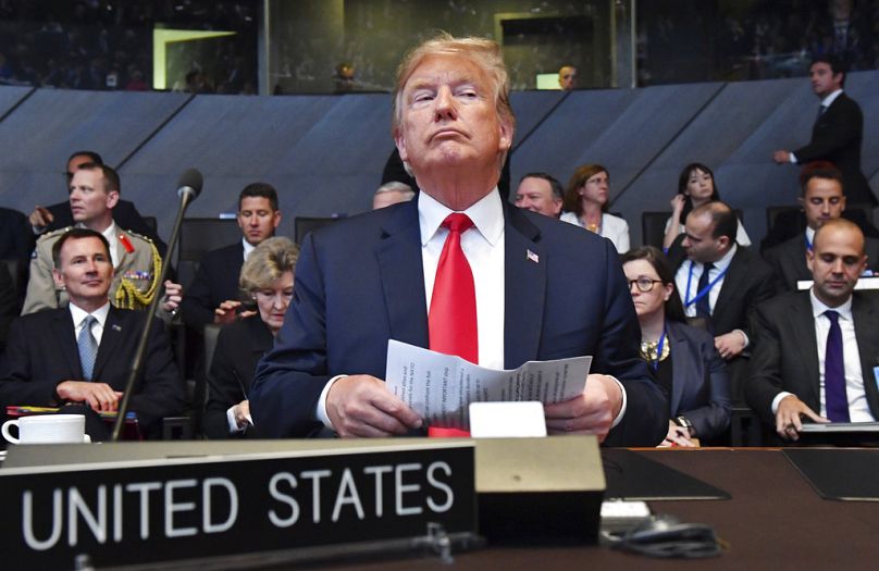 US President Donald Trump attends a meeting of the North Atlantic Council during a summit of heads of state and government at NATO headquarters in Brussels, July 2018, File