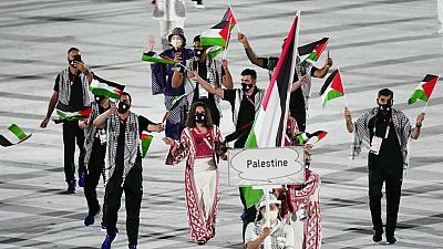 فلسطينيون خلال حفل دورة الألعاب الأولمبية الصيفية 2020 في طوكيو، اليابان