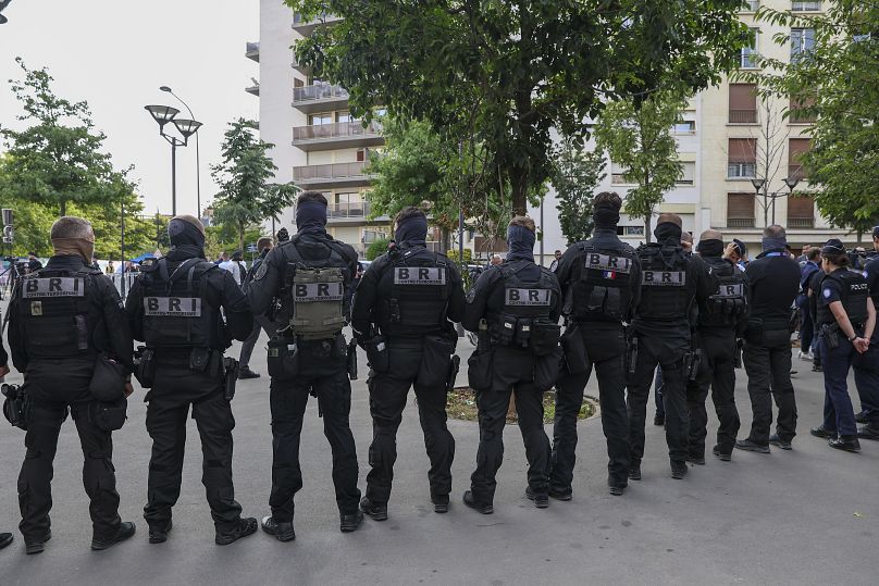 Security stand near the stadium ahead of group stage football match between Israel and Mali at Paris 2024 Summer Olympics.