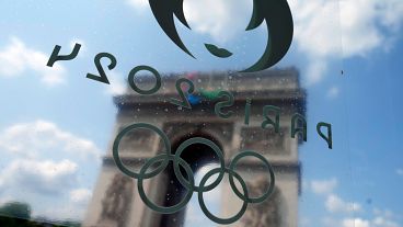 A view of the Arc de Triomphe though the window of a bus ahead of the 2024 Summer Olympics, Wednesday, July 24, 2024, in Paris, France. A view of the Arc de Triomphe though the window of a bus ahead of the 2024 Summer Olympics, Wednesday, July 24, 2024, in Paris, France.