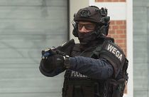 A police officer aims a Taser during a training session in Vienna, July 25, 2024