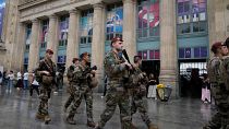 Soldiers patrol outside Gare du Nord train station at the 2024 Summer Olympics, Friday, July 26, 2024, in Paris, France.
