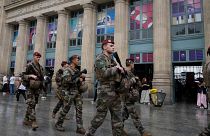 Soldiers patrol outside Gare du Nord train station at the 2024 Summer Olympics, Friday, July 26, 2024, in Paris, France.