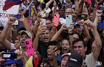 Supporters of opposition's presidential candidate Edmundo Gonzalez cheer during his closing election campaign rally in Caracas, Venezuela, Thursday, July 25, 2024. The preside