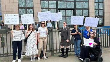 Some of the patients protesting against Ocaliva's ban posing in front of the EU Council.