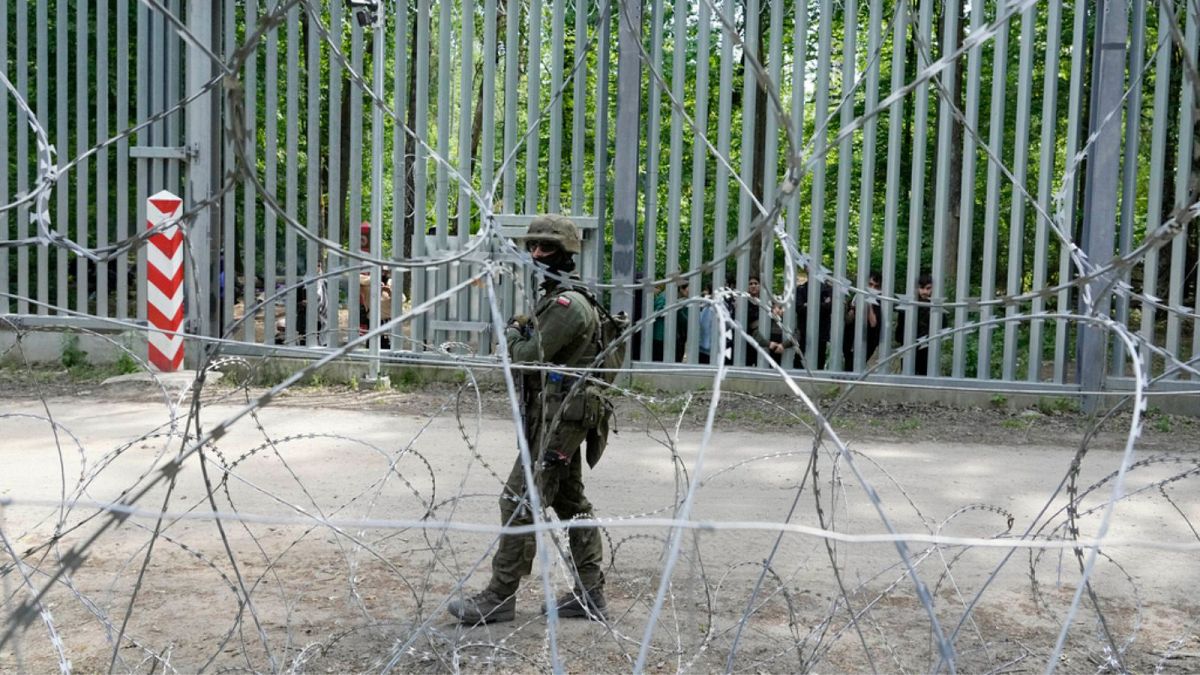 A Polish soldier patrols the border with Belarus