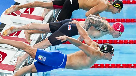 Adam Peaty, of Britain, competes during a heat in the men's 100-meter breaststroke at the 2024 Summer Olympics, Saturday, July 27, 2024, in Nanterre, France