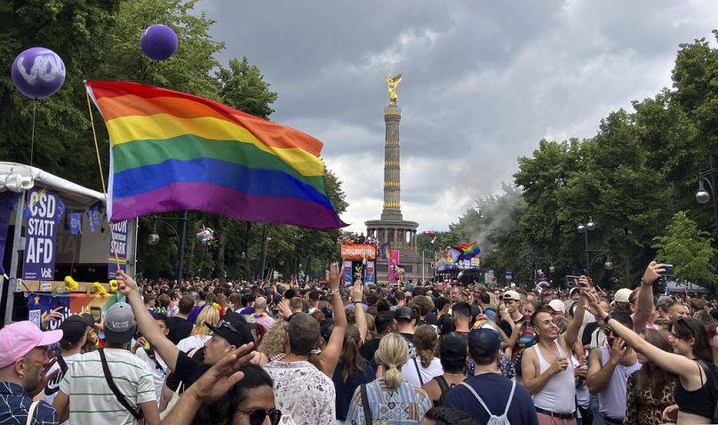 People celebrate at the 46th Berlin Pride parade for Christopher Street Day (CSD) in Berlin, Saturday July 27, 2024.