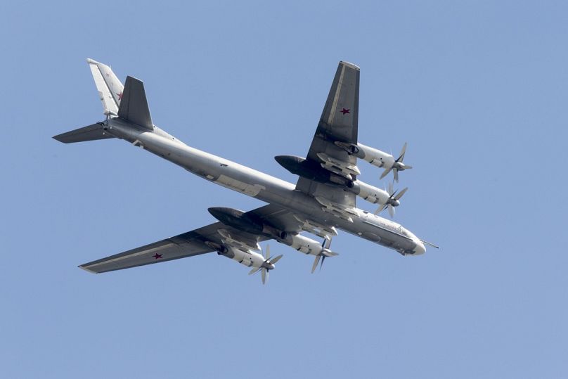 Russian the Tu-95 strategic bomber fly over Red Square during the general rehearsal for the Victory Day military parade which will take place at Moscow's Red Square.