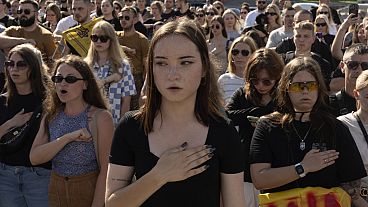 People sing the national anthem at a rally demanding the release of Ukrainian prisoners of war who are held in captivity in Russia, at Independence Square in Kyiv, Ukraine, Su