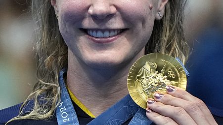 Sweden's Sarah Sjoestroem poses with her gold medal following the women's 100-metre freestyle final at the 2024 Summer Olympics, 31 July 2024, FILE 
