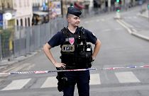 A French police officer stands guard ahead of the opening ceremony of the Paris Summer Olympics, 29 July 2024, File