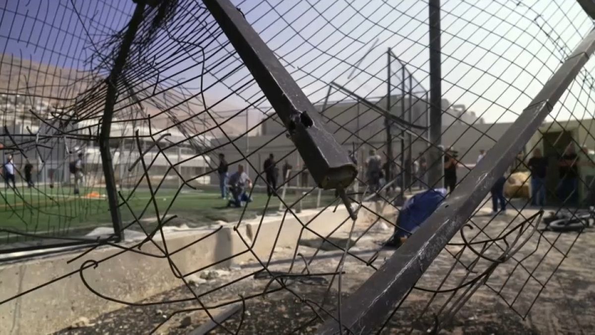 The blast bent the metal fence around the football field