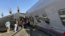 passengers are seen at a place of the derailment of a passenger train in Kotelnikovo, about 1200km south of Moscow, Volgograd region, 29 July 2024