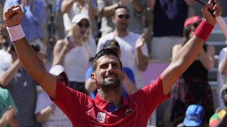 Djokovic celebrates after defeating Rafael Nadal in their men's singles second round match at the Roland Garros stadium at the 2024 Summer Olympics.