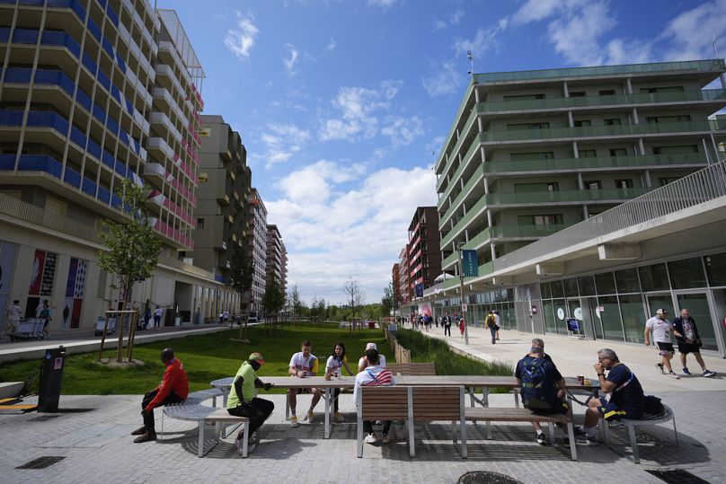 Athletes and team members lounge inside the Olympic Village at the 2024 Summer Olympics.