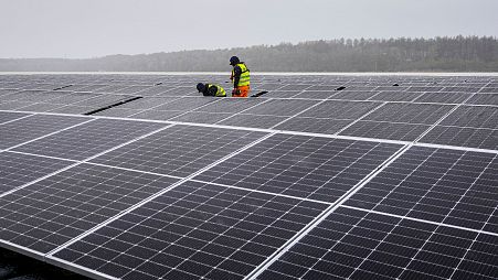  Solar panels are installed at a floating photovoltaic plant on a lake in Haltern, Germany.