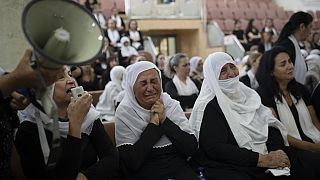 Members of the Druze minority attend a memorial ceremony for the children and teens, killed in a rocket strike in the village of Majdal Shams (AP Photo/Leo Correa)