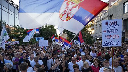 People attend a protest in Sabac, Serbia, Monday, July 29, 2024. (AP Photo/Darko Vojinovic)