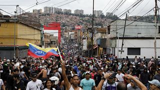 Protesters demonstrate against the official election results declaring President Nicolas Maduro won reelection in the Catia neighborhood of Caracas, Venezuela, Monday, July 29