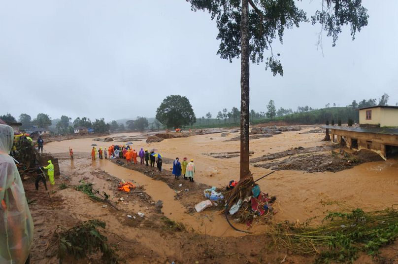 Rescuers and others inspect the spot after landslides hit hilly villages in Wayanad district, Kerala state, India, Tuesday, July 30, 2024. 