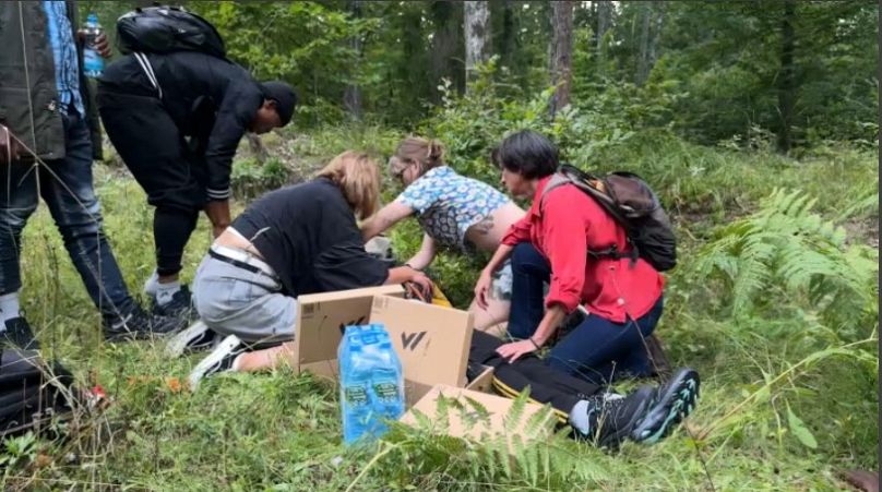 Reporter Valerie Gauriat with NGO volunteers helping migrants at the Polish/Belarus border 