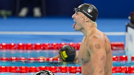 Nicolo Martinenghi, of Italy, celebrates after winning the men's 100-meter breaststroke final at the 2024 Summer Olympics.