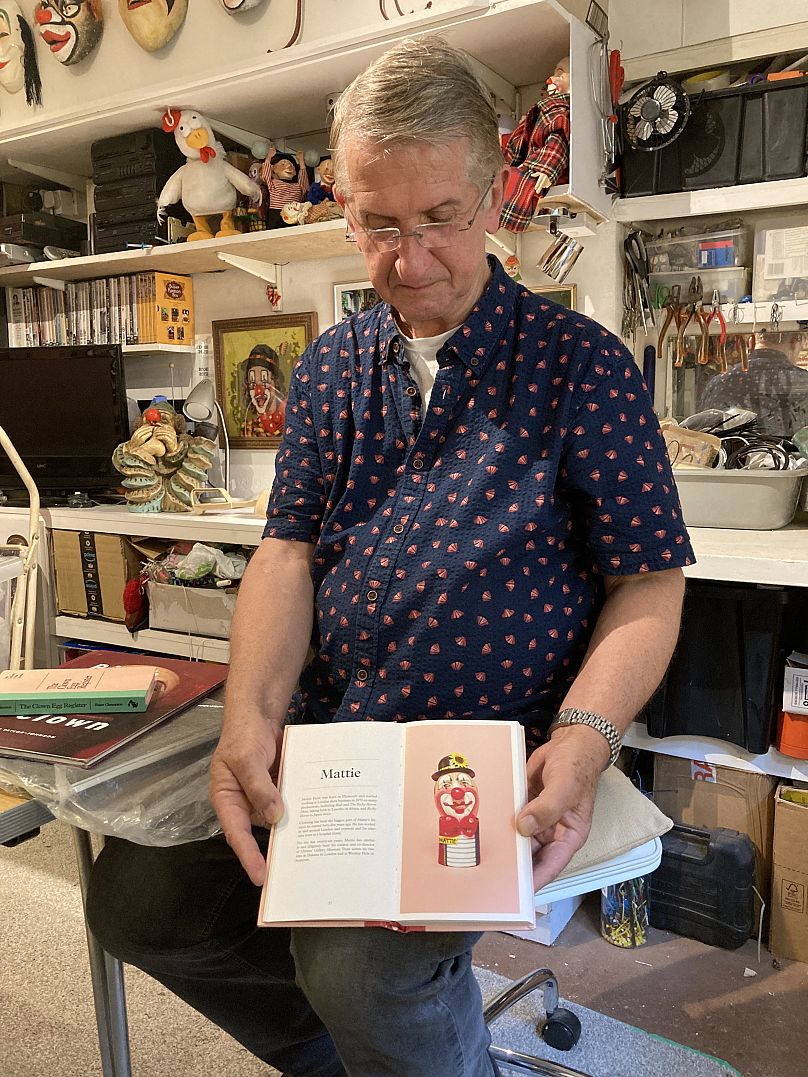 Mattie with a picture of his egg in 'The Clown Egg Register' book, published in 2017. 