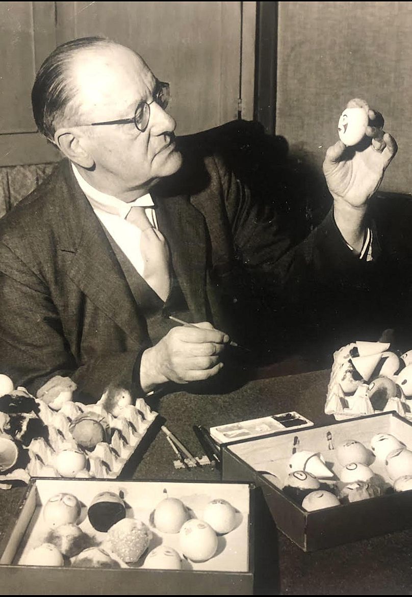 Stan Bult painting some of the original clown eggs. 