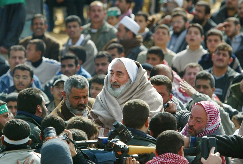 Ismail Haniyeh next to the spiritual leader of Hamas Sheikh Ahmed Yassin in Jabaliya refugee camp, 14 February 2003