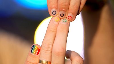 Jeremy Goupille shows his nails painted with the rainbow colours and the Olympic rings at the opening of Pride House, during the 2024 Summer Olympics, 29 July 29, in France.