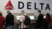Passengers use Delta Air Lines' self check-in counter (file photo)