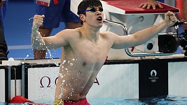 Pan Zhanle, of China, celebrates after winning the men's 100-meter freestyle final at the 2024 Summer Olympics, Wednesday, July 31, 2024