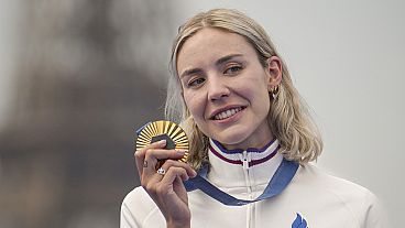 Gold medal winner, France's Cassandre Beaugrand poses with her medal during a medal ceremony for the women's individual triathlon competition at the 2024 Summer Olympics