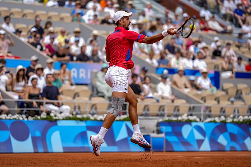 Serbia's Novak Djokovic returns the ball against Germany's Dominik Koepfer during the men's single tennis competition at the Roland Garros stadium