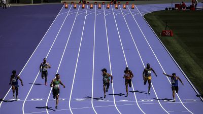 Athletes run on the track during a rehearsal at the Stade de France stadium on June 25, 2024, in Saint-Denis, outside Paris.