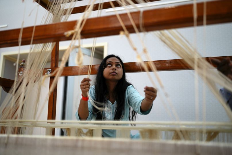 India House showcases the nation's rich culture by bringing traditional sari weavers