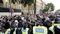 Police officers clash with protesters during a 'Enough is Enough' protest rally