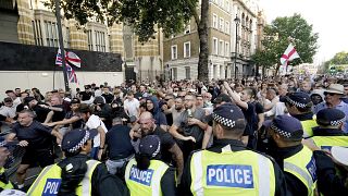 Police officers clash with protesters during a 'Enough is Enough' protest rally