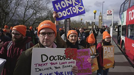 Junior doctors, members of the BMA (British Medical Association), take part in a strike on the picket line outside the St Thomas' Hospital in London.