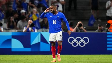 France's Alexandre Lacazette celebrates after scoring his side's first goal during the men's Group A football match between France and the United States