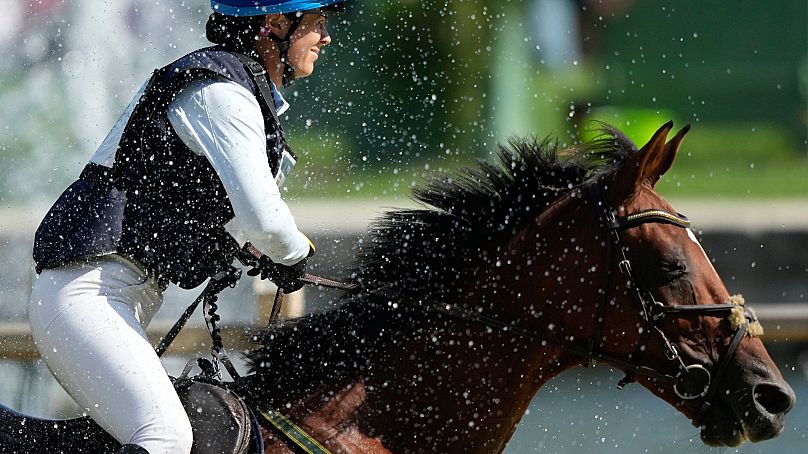 Sweden's Sofia Sjoborg, rides, Bryjamolga Vh Marienshof during the Equestrian Cross Country competition at Chateau de Versailles for the 2024 Summer Olympics, 28 July 2024. 