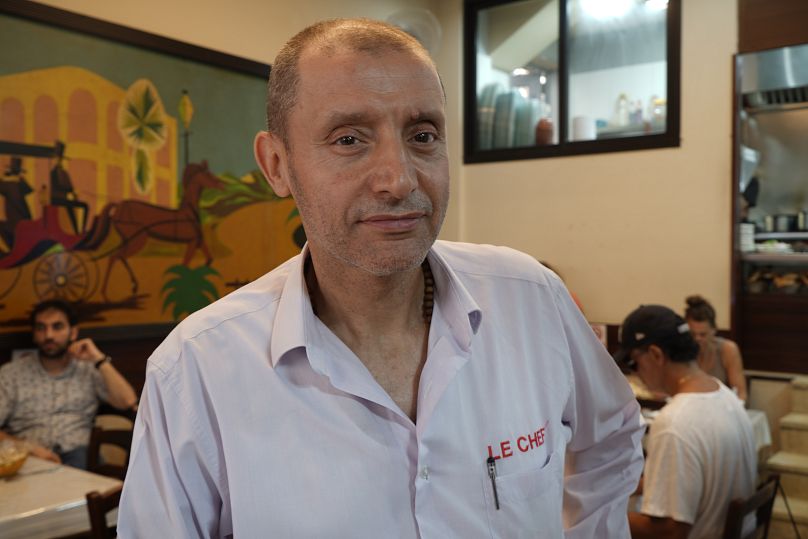 "Le Chef" owner Charbel Bassil poses for a photo in his restaurant in Beirut, July 2024