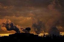 Smoke rises from the chimneys of the Tenaris steel mill factory, in Dalmine, northern Italy, Wednesday, Feb. 10, 2021.