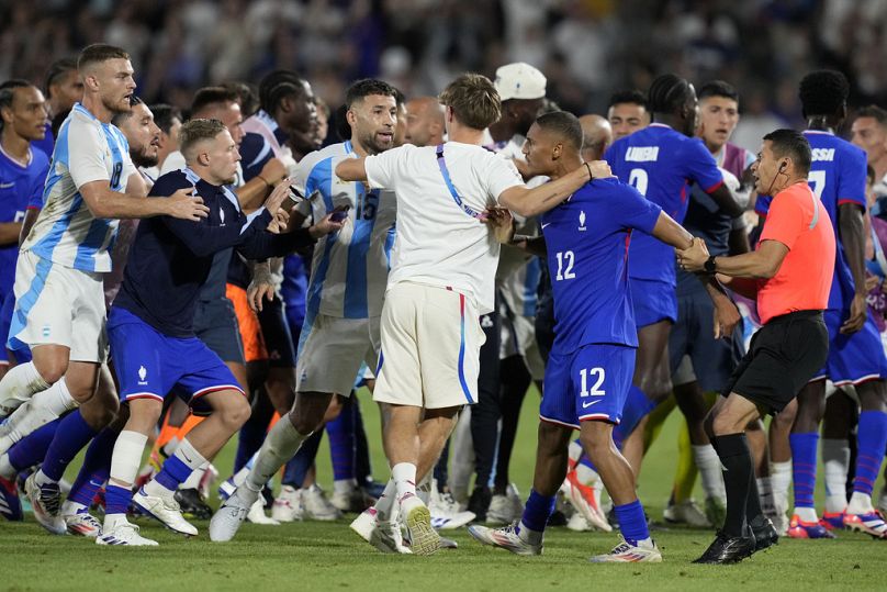 France and Argentina players argue at the end of a quarterfinal soccer match between France and Argentina in Boredaux