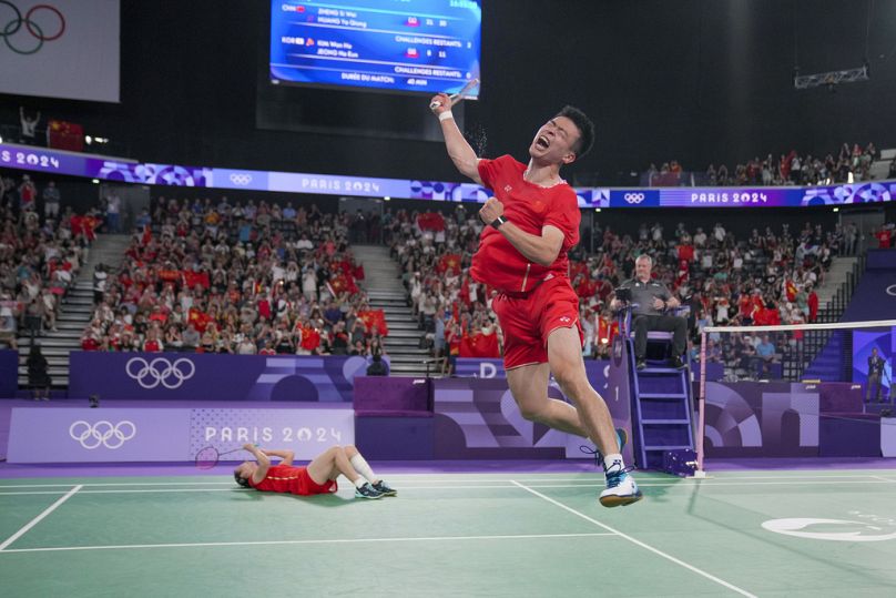 China's Zheng Si Wei, right, and Huang Ya Qiong celebrate after defeating South Korea's Kim Won-ho and Jeong Na-eun in their mixed doubles badminton final match.