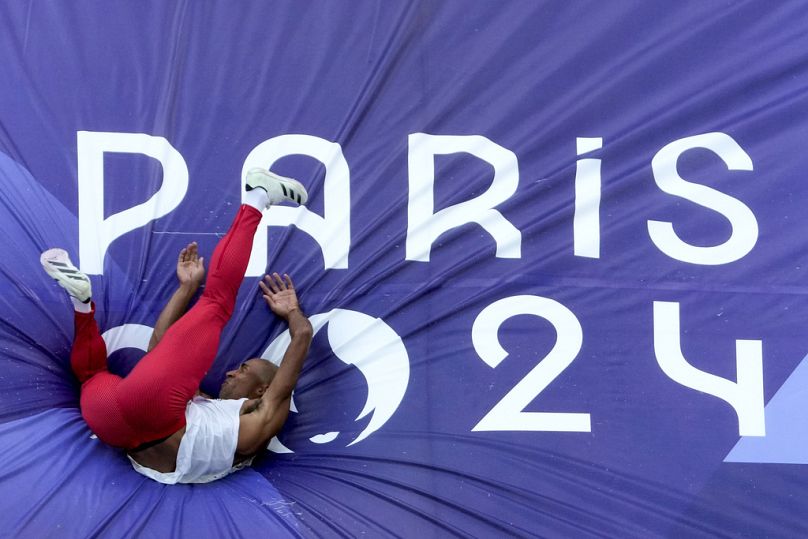 Damian Warner, of Canada, competes in the decathlon high jump at the 2024 Summer Olympics, Friday, Aug. 2, 2024, in Saint-Denis, France. 