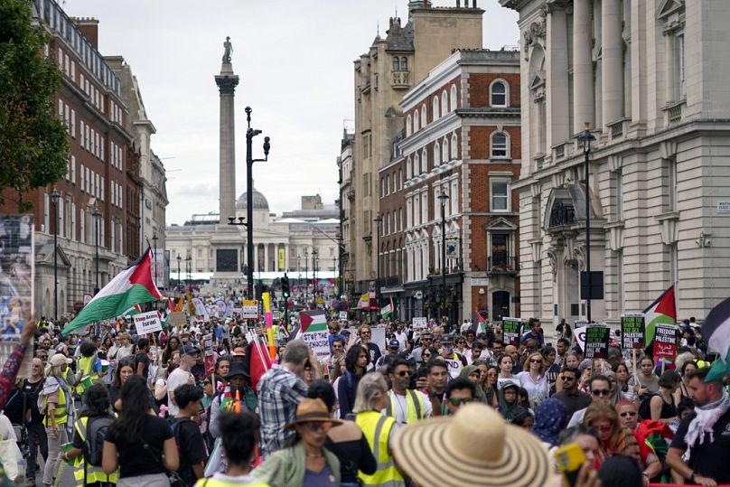 Demonstrators march in support of Palestinians, in London, Saturday, Aug. 3, 2024.